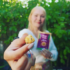 woman holding dried passion fruit edible snacks