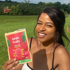 woman holding jungle fruits exotic dried lychee in london after it being delivered