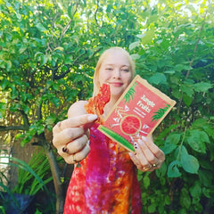 woman holding jungle fruits dried watermelon snacks 